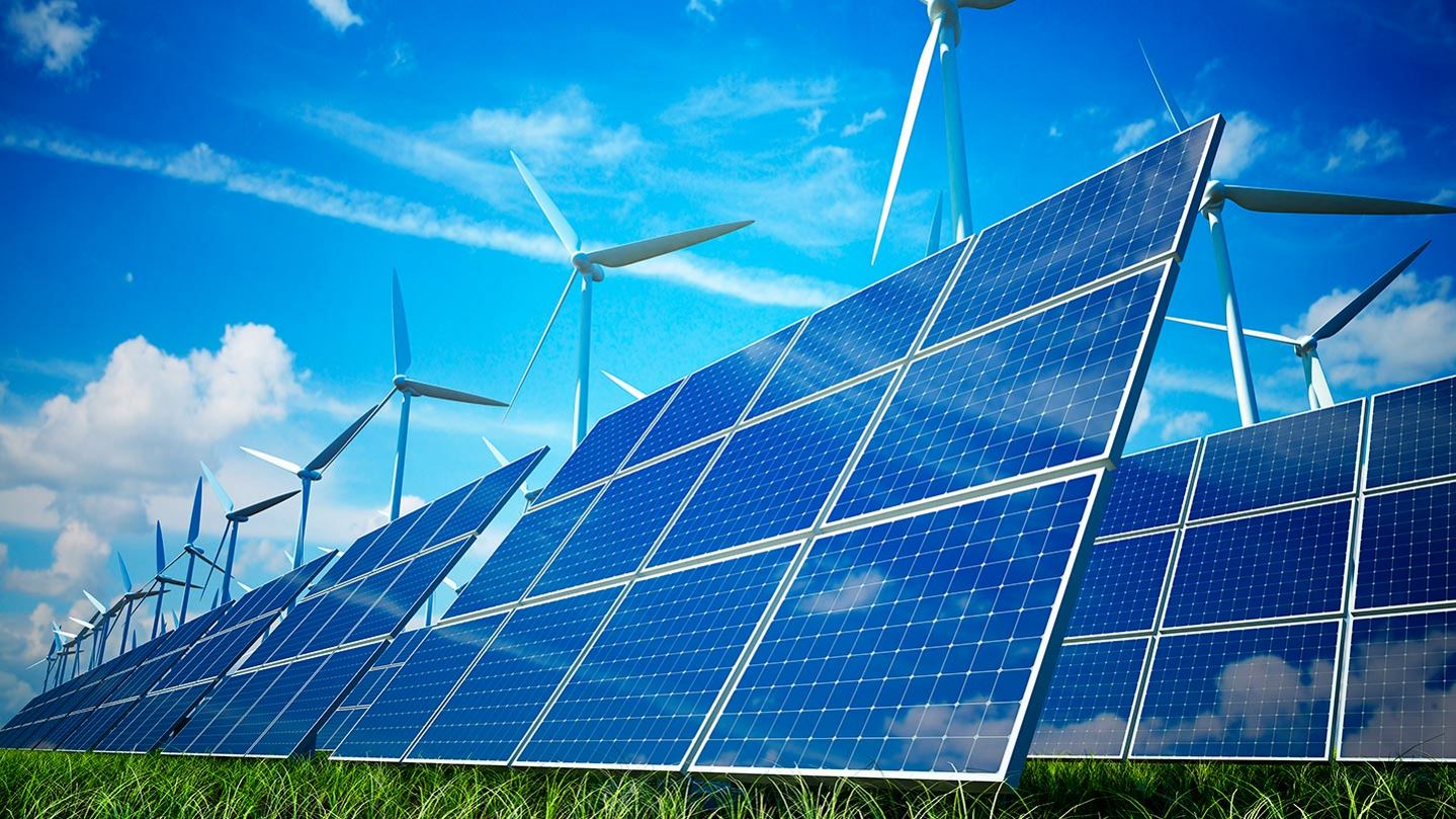 Solar panels, with windmills in the background