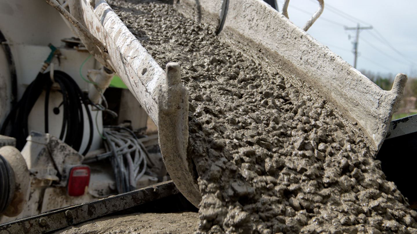 Cement truck pouring concrete