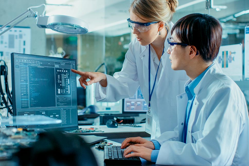 People working on computer in lab